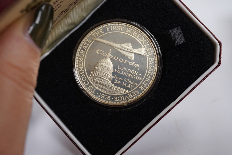 Ten silver medals in original boxes commemorating Concorde and Elizabeth II silver jubilee